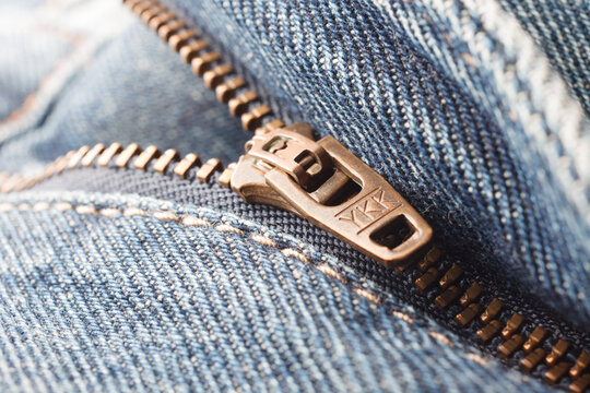 Kharkiv, Kharkiv region Ukraine - 01.30.2024: YKK brass zipper on jeans