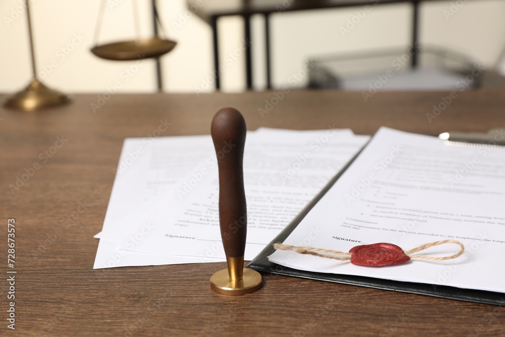 Canvas Prints Documents and stamp on wooden table, closeup. Notary contract