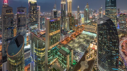 Skyline view of the high-rise buildings on Sheikh Zayed Road in Dubai aerial day to night timelapse, UAE.