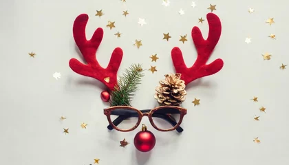 Rolgordijnen christmas deer concept creative layout made of reindeer antlers hipster glasses and christmas decoration on white background minimal flat lay new year holiday idea greeting card © Emanuel