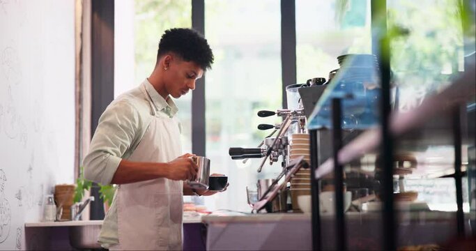 Man, machine and barista steam milk at cafe, process and professional service in small business. Person, cup and waiter prepare espresso drink, pour latte and hot cappuccino beverage in coffee shop