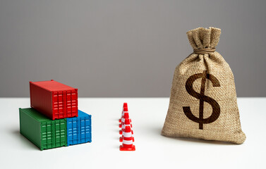 Shipping containers with goods and dollar money bag are separated by a barrier. Break a trade deal....