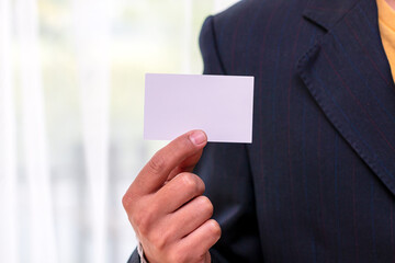 Close-Up of Businessman Holding Blank Card with copy space;Identity and Professionalism