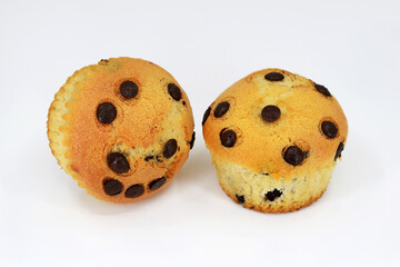 Delicious homemade muffins with chocolate chips, white background