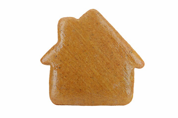 Undecorated gingerbread in a shape of house isolated on white background