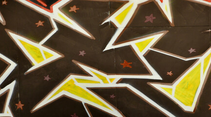 Colorful background of graffiti painting artwork with bright aerosol outlines on wall. Old school...