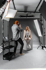Photographer and fashion model in studio for creative art, clothes brand and designer social media...
