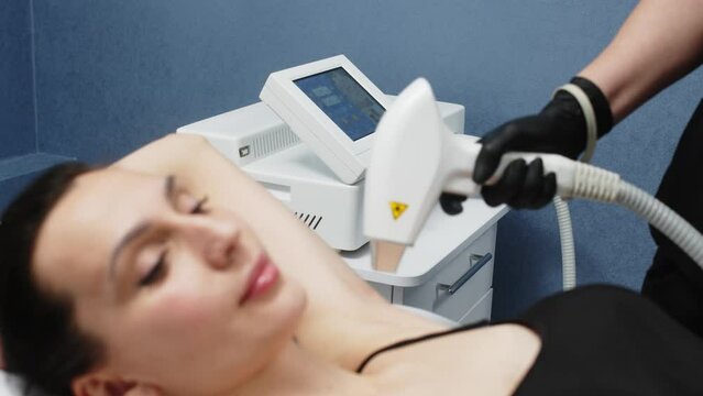 Hair removal with a diode laser in a cosmetologist's office, hair removal for smooth skin, laser procedure in a beauty studio or clinic, body care hair removal. Laser hair removal.