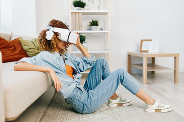 Virtual Reality Fun: A Smiling Woman Enjoying a Futuristic VR Game on the Sofa at Home