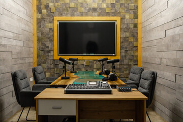 Empty living room prepared to record online podcast. Modern sound equipment and station. Filming live broadcast show with microphone for social media internet content.