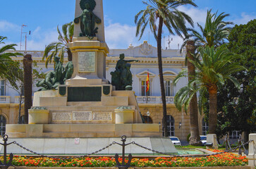 Obraz premium Romantic backstreet, side street and alleys in historic old town of Cartagena, Spain with historic Spanish style architecture facades, a landmark sightseeing tourist spot in downtown