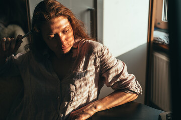 Obraz premium Woman Pondering with Pen at Home Office