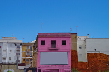 Street city view with cars and traffic, house facades cityscape skyline of Huelva, Spain Cristopher Columbus birth place