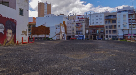 Obraz premium Street city view with cars and traffic, house facades cityscape skyline of Huelva, Spain Cristopher Columbus birth place