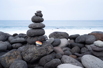 Balance stone tower on sea shore