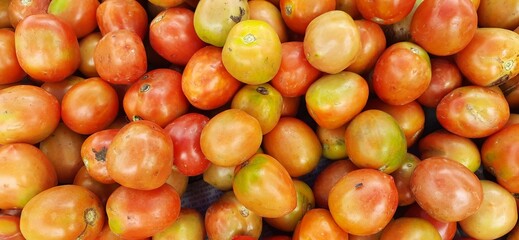 Pile of fresh tomatoes are used for ingredient cookery in Indonesia. Sold in local market