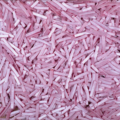 Colorful and bright cake decorations, in powder and granule form, can also be used as a colorful background.