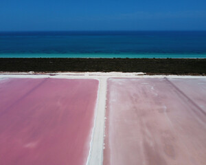 aerial view of pink salt lake and Caribbean sea at Las Coloradas in Mexico. Travel concept