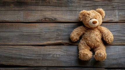 stuffed teddy bear on wooden background