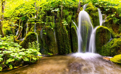 Cascade panorama at Plitvice Lakes or “Plitvička jezera“ National Park in Croatia with bright...