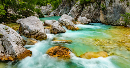 Cascade of famous Soča or Isonzo River (Emerald River) in the Julian Alps, Slovenia. Crystal clear...