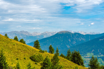 Obraz premium Beautiful panoramic alpine landscape in summer. Mountains near the city of Innsbruck, Austria. In the foreground is the mountain Patscherkofel 2246 m, distinguished by its transmission tower.