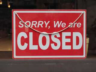 sorry closed sign in shop window