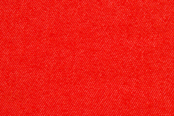 Red cotton twill fabric pattern close up as background
