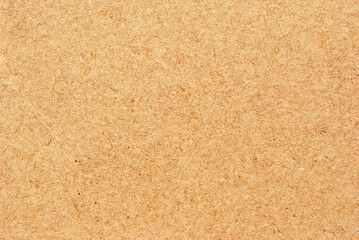 A sheet of brown recycled cardboard texture as background
