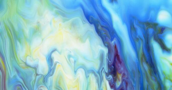 Moving marble texture background. Fluid art of flowing blue and yellow colors on a white background.