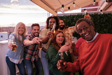 Selfie of group of friends at a home party and celebrating together. Concept: fun, bond