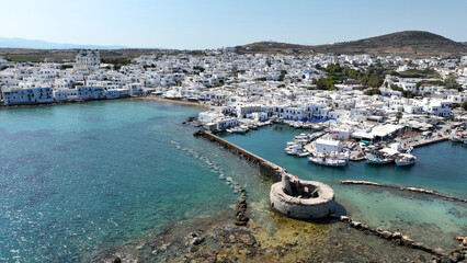 Fototapeta na wymiar Aerial drone photo from picturesque small seaside village of Naoussa with traditional Cycladic character, Paros island, Cyclades, Greece