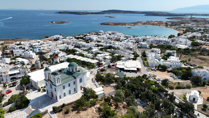 Aerial drone photo from picturesque small seaside village of Naoussa with traditional Cycladic...