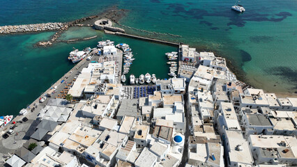 Aerial drone photo from picturesque small seaside village of Naoussa with traditional Cycladic...