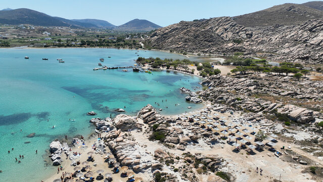 Aerial drone photo of famous small organised beach with unique rock formations of Kolimbithres or Kolympithres in the gulf of Naousa, Paros island, Cyclades, Greece