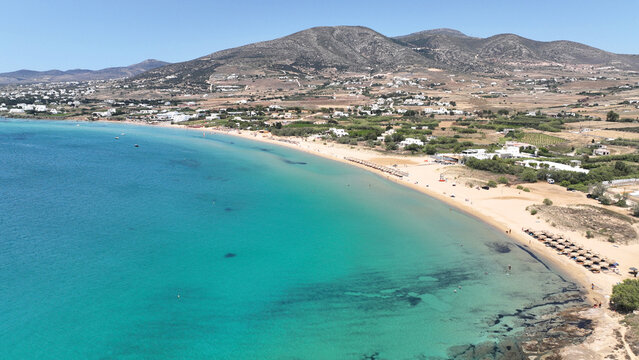 Aerial drone photo of famous for surfers sandy beach of Chrysi Akti or Golden beach with crystal clear emerald sea calm with no wind, Paros island, Cyclades, Greece