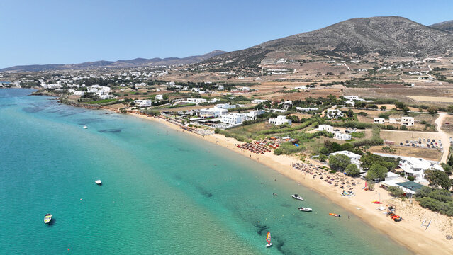Aerial drone photo of famous for surfers sandy beach of Chrysi Akti or Golden beach with crystal clear emerald sea calm with no wind, Paros island, Cyclades, Greece