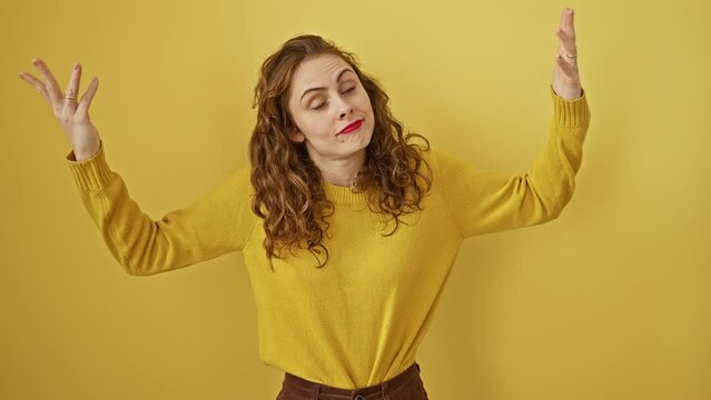 Young beautiful woman standing shouting and screaming loud to side with hand on mouth. communication concept. over isolated yellow background