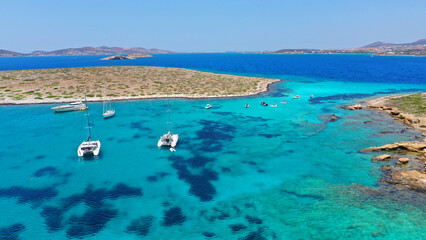 Aerial drone photo from tropical exotic paradise secluded rocky island bay with deep turquoise and...