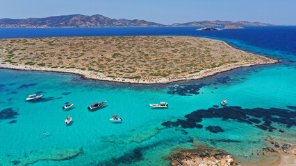 Aerial drone photo of azure paradise blue lagoon of Panteronisi a small islet complex between Paros...
