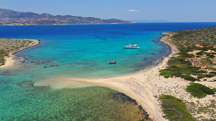 Aerial drone photo from tropical exotic paradise secluded rocky island bay with deep turquoise and...