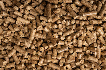 Wood pellet background. Close up natural wood pellet. Ecological heating, renewable energies Biofuels. Top view. Flat ecological fuel for solid fuel boilers