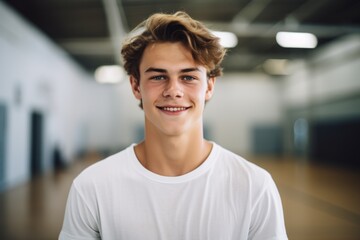 Smiling portrait of a teenage male student during gym class