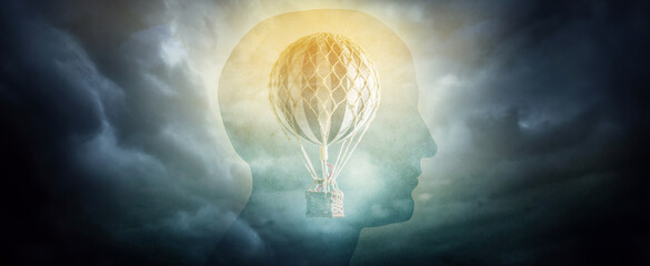 Silhouette of a man with a balloon, aerostat (symbol of freedom of thought). Concept on the theme...