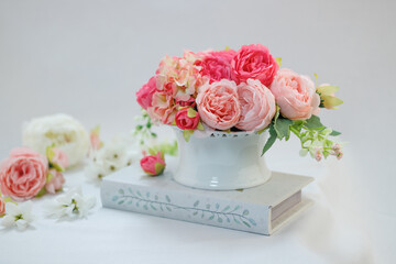 Still life of Pink peonies in white vase isolated on white background 