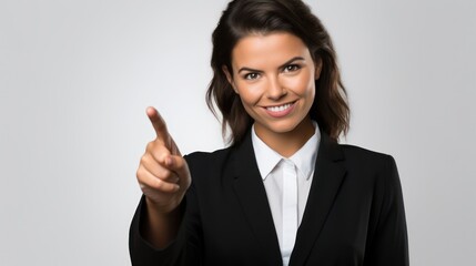Fototapeta premium A businesswoman, indicating with the index finger