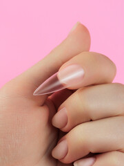 Step-by-step instructions for nail extension on gel tips. Manicure, hands in the foreground. Pink background. Copy space
