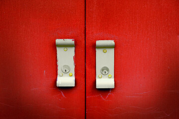 Red Industrial Metal Door with Handles for Opening and Locks
