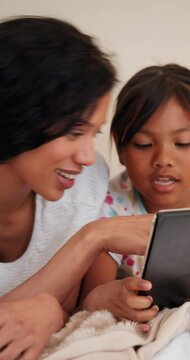 Smile, mother and kid on tablet in home, learning or conversation of funny family bonding together. Happy mom, girl and child on tech to watch video, cartoon or play game on education app in bedroom