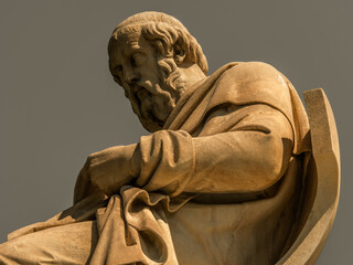 Plato marble statue, the ancient Greek philosopher, isolated on plain sky background. Travel to...
